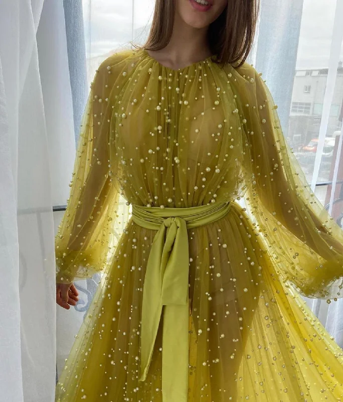 Midi dresses with geometric cutouts for a contemporary and edgy lookRosary Beaded Gown