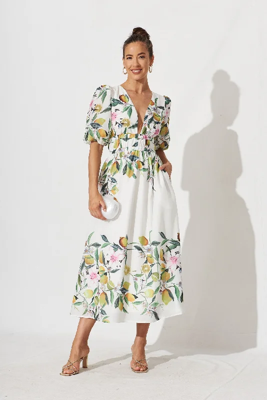 Maxi dresses with a gathered skirt for a voluminous and dramatic effectCamille Maxi Dress In White With Yellow Print Maxi dresses with a gathered skirt for a voluminous and dramatic effectCamille Maxi Dress In White With Yellow Print