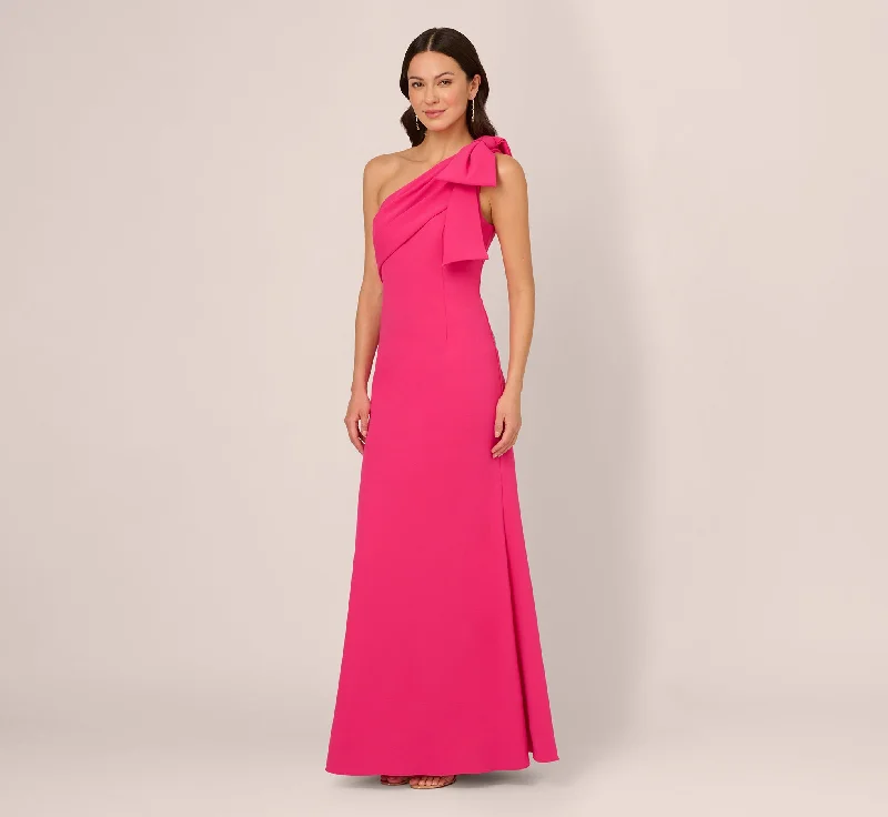 Maxi dresses with a criss - cross back for a flirty and unique detailStretch Crepe One Shoulder Mermaid Gown With Bow Accent In Hot Pink Maxi dresses with a criss - cross back for a flirty and unique detailStretch Crepe One Shoulder Mermaid Gown With Bow Accent In Hot Pink